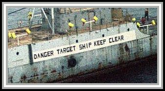 photograph of sign on ship "DANGER TARGET SHIP KEEP CLEAR"