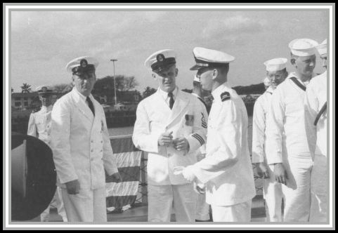photograph of (L. to R.) Chief Electronics Technician Hopkins, Master Chief Shupzinski, and Jim Moon 01/1960. 