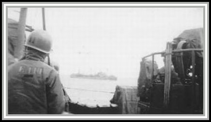 photograph showing SAVAGE escorting a tanker